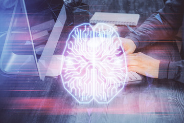 Man typing on keyboard background with brain hologram. Concept of big Data. Double exposure.
