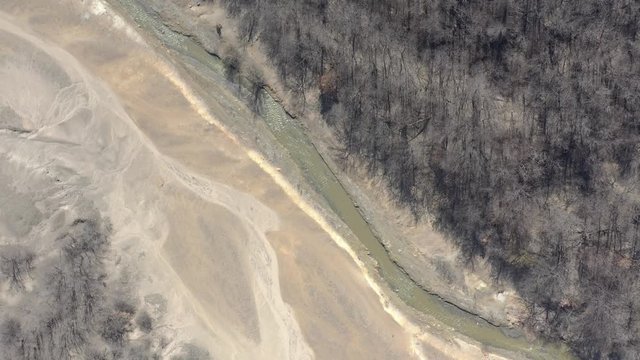 Polluted river area with mine drainage leftovers 4K aerial footage