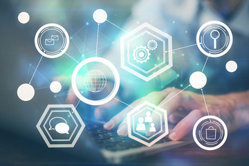Media network theme hologram with man working on computer on background. Concept of internet...