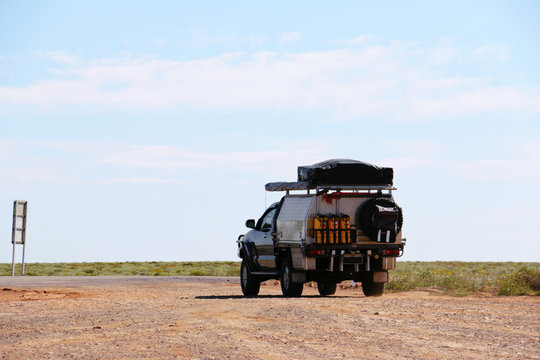 4x4 off-road car exploring Australian Outback. Stewart Highway in the middle of a desert. Hi-res stock photo