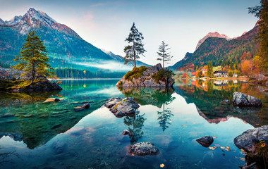 Beautiful autumn scene of Hintersee lake. Colorful morning view of Bavarian Alps on the Austrian...