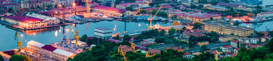 Panorama of port and city of La Spezia. Colorful sunrise of Mediterranean sea, Liguria, Italy,...