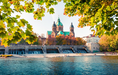 Great autumn view of Landmark Protestant St. Luke's Church. Bright morning cityscape of Munich,...
