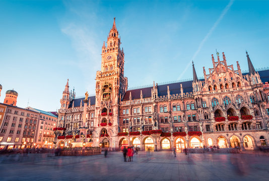 Fantastic evening view of Marienplatz - City-center square & transport hub with towering St. Peter's church, two town halls and a toy museum, Munich, Bavaria, Germany, Europe.