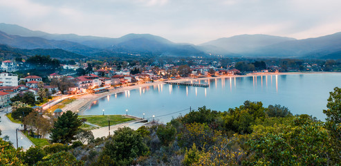 Fototapeta na wymiar Misty spring scene of the Aegean sea. Colorful sunset of the Olimpiada town, Greece, Europe. Traveling concept background. Traveling concept background.