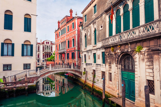 Bright spring view of Vennice with famous water canal and colorful houses. Splendid morning scene in Italy, Europe. Magnificent Mediterranean cityscape. Traveling concept background.