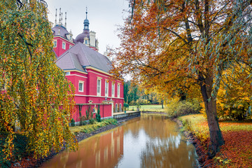 Fototapeta premium Picturesque autumn morning of Muskau castle. Nice morning scene in Muskau Park, UNESCO World Heritage Site, Upper Lusatia region, Saxony, Germany, Europe. Traveling concept background.