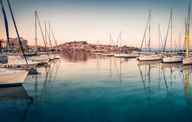 Fototapeta premium Splendid spring seascape on Aegean Sea. Amazing morning view of Kavala city, the principal seaport of eastern Macedonia and the capital of Kavala regional unit, Greece, Europe.