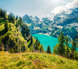 Colorful summer view of unique Oeschinensee Lake. Splendid outdoor scene of Swiss Alps with Bluemlisalp mountain, Kandersteg village location, Switzerland, Europe. Instagram filter toned.