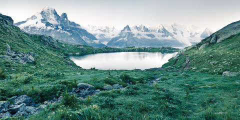 Beautiful summer view of the Lac Blanc lake with Mont Blanc (Monte Bianco) on background, Chamonix location. Beautiful outdoor scene of Graian Alps, France, Europe. Instagram filter toned.