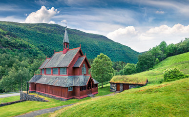 Obraz premium Beautiful summer view of Borgund Church, located in the village of Borgund in the municipality of Lerdal in Sogn og Fjordane county, Norway. Traveling concept background.