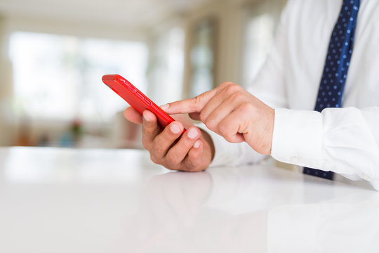 Close up of business man hands using smarpthone