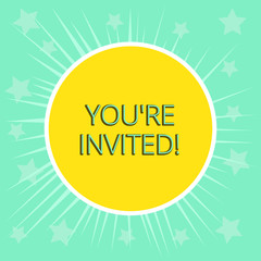 Conceptual hand writing showing You Re Invited. Concept meaning You are happily encouraged to attend and event or a party Yellow Sun White Border Rays Green Background Translucid Stars