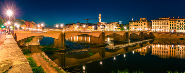 Fototapeta na wymiar Great evening scene with Ponte alle Grazie bridge over Arno river. Enchanted night view of Florence, Italy, Europe. Traveling concept background.