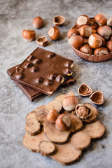 Homemade hazelnut chocolate bar. Nuts and chocolate background. Ingredients for cooking homemade chocolate sweets. Confectionery and sweets concept