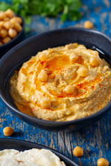 hummus on a wooden surface
