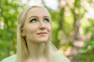 Naklejka premium Summertime portrait of young woman in dress.