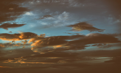 Fototapeta premium Beautiful colorful sky with clouds and sunlight. Color toned.