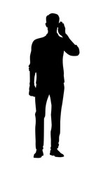 Silhouette of man with hand to ear listens. 