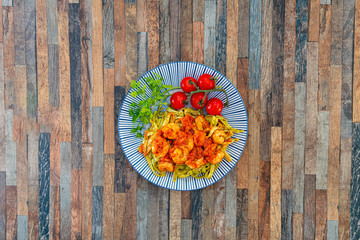 Small Gambas, stewed tomatoes, Tagliatelle with pesto