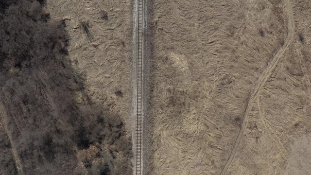Old railroad track in the meadow 4K aerial footage