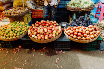 Tasty grapes and pomegranates in street market in Goa