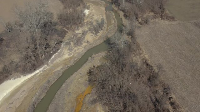 River flow and coastal area polluted from metal mining 4K aerial video