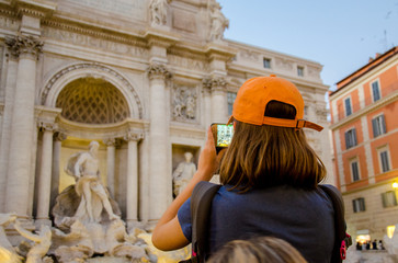 Fototapeta na wymiar young woman taking a photo in Rome