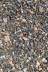 Ground stone grey background of many small stones