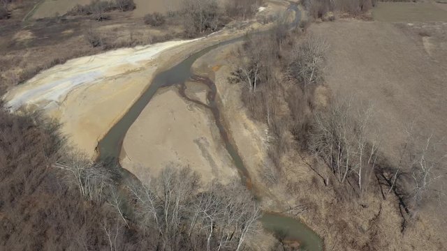 Polluted coastal areas of river flow 4K aerial video