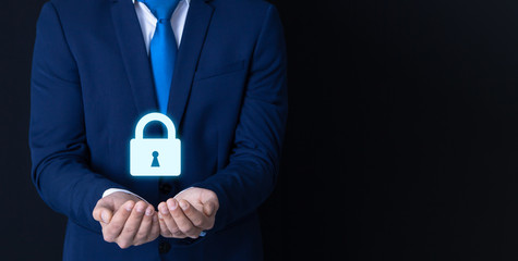 a businessman holds a lock; security icon; business concept