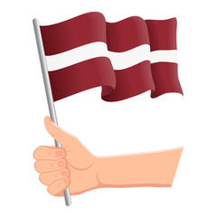 Hand holding and waving the national flag of Latvia. Fans, independence day, patriotic concept. Vector illustration, eps 10.