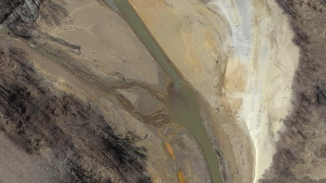 River coast polluted with mine drainage 4K aerial footage
