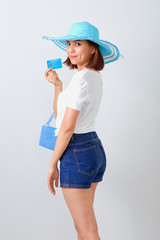 Woman holding Credit card summer holiday