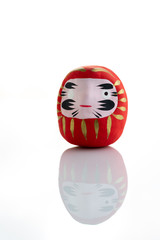 Traditional japanese Daruma doll symbol of fortune and luck isolated in white background
