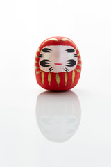 Traditional japanese Daruma doll symbol of fortune and luck isolated in white background