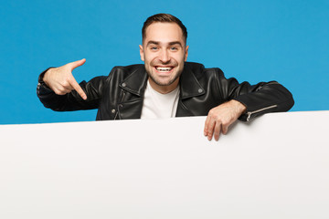 Handsome young unshaven man hold big white empty blank billboard for promotional content isolated...