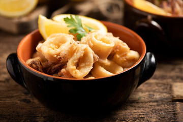 Traditional Italian fried calamari and lemon slice