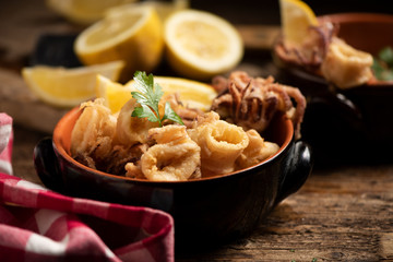 Traditional Italian fried calamari and lemon slice