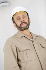 portrait of a handsome repairman in workwear