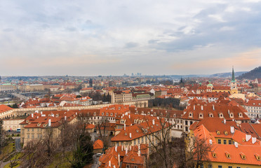 Fototapeta na wymiar Panoramic ariel view of famous historical Old Town in Prague city, capital of Czech Republic at late afternoon at Winter time. 