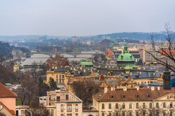 Fototapeta na wymiar Ariel view of Prague city, capital of Czech Republic at late afternoon, cloudy day on Winter.