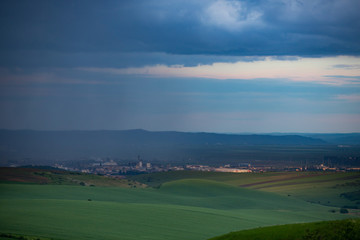 Heavy rain over the meadows at evening.