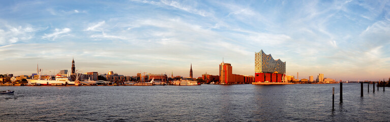 Panorama of the harbour of Hamburg with the Elbphilharmonie in evening light.