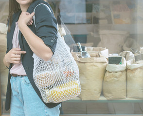 woman is bying products in zero waste shop