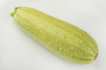 Fresh zucchini isolated on a gray background