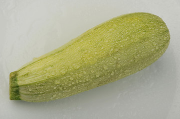Fresh zucchini isolated on a gray background