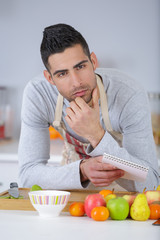 man with recipe thinking