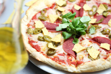 Vegetarian pizza with soy salami. A healthy meatless diet.