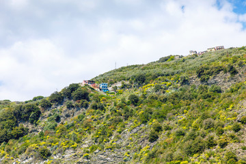 Fototapeta na wymiar Liguria, Italy coastline of Riviera with colorful houses on sunny warm day. Monterosso al Mare, Vernazza, Corniglia, Manarola and Riomaggiore, Cinque Terre National Park UNESCO World Heritage